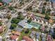 Scenic aerial view showing the community, featuring a pool, tennis court, and charming homes nestled among trees and lakes at 5813 Parkview Point Dr, Orlando, FL 32821