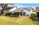 Aerial view of a backyard with a screened patio and a well-maintained lawn at 5813 Parkview Point Dr, Orlando, FL 32821