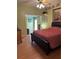 Comfortable bedroom featuring wood laminate flooring and a ceiling fan at 5813 Parkview Point Dr, Orlando, FL 32821