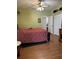 Bedroom offers wood laminate flooring and a closet for storage at 5813 Parkview Point Dr, Orlando, FL 32821