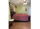 Cozy bedroom boasts wood laminate flooring and a ceiling fan at 5813 Parkview Point Dr, Orlando, FL 32821