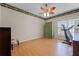 Bright bedroom with wood floors, ceiling fan, large window, and ample space at 5813 Parkview Point Dr, Orlando, FL 32821