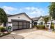 Charming home with a spacious driveway and well-manicured landscaping at 5813 Parkview Point Dr, Orlando, FL 32821