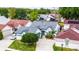 Aerial view of home featuring mature landscaping, a well-manicured lawn, and attached garage at 5813 Parkview Point Dr, Orlando, FL 32821