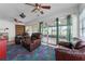 Comfortable living room featuring multiple seating options and sliding glass doors at 5813 Parkview Point Dr, Orlando, FL 32821