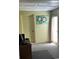 Office space with a desk, computer and textured green walls plus a door and natural light at 5813 Parkview Point Dr, Orlando, FL 32821
