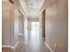 Bright hallway with recessed lighting leads to the living areas and outdoor pool at 611 San Raphael St, Kissimmee, FL 34759