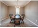 Formal dining room with decorative chandelier and ample space for Gathering gatherings at 611 San Raphael St, Kissimmee, FL 34759