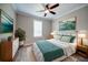 A comfortable bedroom with bright décor, crisp white bedding, bedside tables, and a lovely indoor houseplant at 611 San Raphael St, Kissimmee, FL 34759
