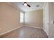Unfurnished bedroom offering natural light, a ceiling fan, neutral paint, and a closet with white doors at 611 San Raphael St, Kissimmee, FL 34759
