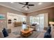 An open concept living room that flows into the kitchen with outdoor access and plenty of natural light at 611 San Raphael St, Kissimmee, FL 34759