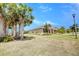 Spacious front yard shows inviting landscaping highlighting this single-story residence at 611 San Raphael St, Kissimmee, FL 34759