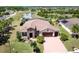 Expansive aerial view highlighting the home's premium lot, landscaping, and brick-paved driveway at 611 San Raphael St, Kissimmee, FL 34759
