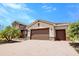 Beautiful exterior view of a single-story home with brick-paver driveway and well-kept lawn at 611 San Raphael St, Kissimmee, FL 34759
