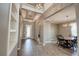 Welcoming entryway and formal dining room with elegant lighting and neutral color palette at 611 San Raphael St, Kissimmee, FL 34759
