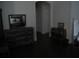 Bedroom showing wood dresser and view into the bedroom with a bed at 2108 Northumbria Dr, Sanford, FL 32771