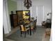 Elegant dining room features a glass table, ornate screen, and stylish chandelier at 2108 Northumbria Dr, Sanford, FL 32771