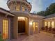 Elegant entryway featuring a turret, double doors, transom windows, and a brick paver courtyard at 2108 Northumbria Dr, Sanford, FL 32771