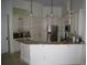 Well-appointed kitchen with granite countertop, stainless appliances, and custom cabinetry at 2108 Northumbria Dr, Sanford, FL 32771