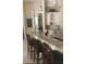 Bright kitchen featuring granite countertops, custom cabinets, pendant lighting and stainless steel appliances at 2108 Northumbria Dr, Sanford, FL 32771