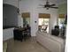 Open-concept living area has vaulted ceilings, travertine floors, and sliding doors to the patio at 2108 Northumbria Dr, Sanford, FL 32771