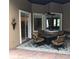 Cozy outdoor patio features a fire pit table with seating for four and an ornate patterned rug at 2108 Northumbria Dr, Sanford, FL 32771