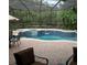 Outdoor pool and patio area with furniture and umbrella at 2108 Northumbria Dr, Sanford, FL 32771