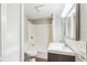 Updated bathroom features a modern vanity, tub/shower combination, wood-look vinyl floors and ample lighting at 250 E 20Th Ave, Mount Dora, FL 32757