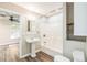Updated bathroom featuring a pedestal sink, tub with shower, and modern fixtures, plus wood-look vinyl floors at 250 E 20Th Ave, Mount Dora, FL 32757