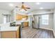Well-equipped kitchen with stainless steel appliances, wood cabinetry, and ample countertop space at 250 E 20Th Ave, Mount Dora, FL 32757