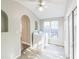 Light and bright laundry room with a window, modern washer and dryer, and tile floor at 250 E 20Th Ave, Mount Dora, FL 32757