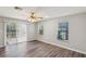 Bright living area with sliding glass doors, ceiling fan, and a view of the outdoor deck at 250 E 20Th Ave, Mount Dora, FL 32757
