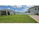 A large grass yard, complete with a new fence on a sunny day at 3043 Beaver Creek Dr, Kissimmee, FL 34746
