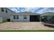 View of the home's backyard featuring a brick paver patio at 3043 Beaver Creek Dr, Kissimmee, FL 34746