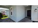 A view of the home's front door and side exterior with stone entryway pavers at 3043 Beaver Creek Dr, Kissimmee, FL 34746