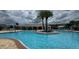 Large, sparkling community pool offers a refreshing escape with plenty of space for swimming and relaxing at 3043 Beaver Creek Dr, Kissimmee, FL 34746