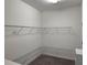 This is a walk-in closet with white walls and shelving at 3043 Beaver Creek Dr, Kissimmee, FL 34746