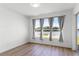 Bright room with wood floors and a large window overlooking the lake at 3561 Somerset Cir, Kissimmee, FL 34746
