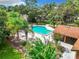 Overhead view of the community pool and surrounding trees, and well maintained grounds at 4060 E Maryland Pl, Casselberry, FL 32707