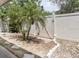 A charming backyard featuring lush palm trees, decorative rocks, and a private fence at 4060 E Maryland Pl, Casselberry, FL 32707