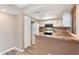 Efficient kitchen featuring bright white cabinets, modern appliances, plenty of storage, and stylish countertops at 4060 E Maryland Pl, Casselberry, FL 32707