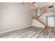 Spacious living room featuring soaring ceilings, a staircase, wood floors and plenty of natural light at 4060 E Maryland Pl, Casselberry, FL 32707