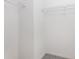 A functional and tidy walk-in closet with white walls and metal shelving units for organization at 4060 E Maryland Pl, Casselberry, FL 32707