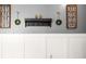 Wall decor and white wainscoting accent the gray wall at 407 Forest Rd, Mount Dora, FL 32757