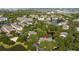 Aerial view of the condo complex surrounded by lush greenery and serene ponds at 5136 Park Central Dr # 212, Orlando, FL 32829