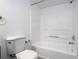 Bathroom showcasing a clean white bathtub and toilet, designed for comfort and convenience at 5136 Park Central Dr # 212, Orlando, FL 32829