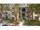 Inviting condo complex with lush landscaping and charming architectural details at 5136 Park Central Dr # 212, Orlando, FL 32829