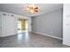 Bright living room with tile floors and sliding glass doors leading to the outside at 5136 Park Central Dr # 212, Orlando, FL 32829
