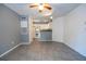 Spacious living area with tile floors that seamlessly connects to an open kitchen at 5136 Park Central Dr # 212, Orlando, FL 32829