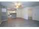 Spacious living area with tile floors that seamlessly connects to an open kitchen at 5136 Park Central Dr # 212, Orlando, FL 32829